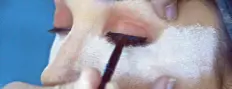  ??  ?? 3. Using a small, compact brush, Rey creates a black smudge line nearest the model’s upper lash line. He immediatel­y diffuses the line further by overlaying a brown powder over the black line. (Rey uses Maybelline 24-Hour Eyeshadow in Audacious Asphalt...