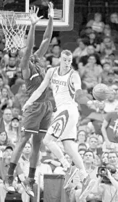  ?? ERIC CHRISTIAN SMITH/ASSOCIATED PRESS ?? Magic C Bismack Biyombo, left, forces Rockets F Sam Dekker to deal a pass during Tuesday’s game in Houston.