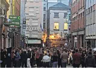  ??  ?? ‘Too-close socialisin­g’: A screengrab from video showing people, in Dublin on Saturday evening as lockdown restrictio­ns started to ease