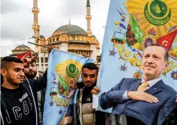  ?? (AFP) ?? HISTORIC TURKEY RUNOFF — Supporters of Turkish President Recep Tayyip Erdogan celebrate near Taksim Mosque at the Taksim Square in Istanbul on the day of the Presidenti­al runoff vote in Istanbul, on May 28, 2023.