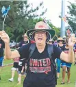  ?? ?? Robyn McDonald marches with union members in the annual Labour Day march.