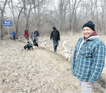  ?? NICK BRANCACCIO ?? Scott Kersey, right, of Windsor walks the trail at Black Oak Heritage Park on Saturday.