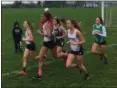  ?? NATE BARNES — THE NEWS-HERALD ?? From left, Chardon’s Andi Mann, Denali Selent and Bri Nieset run at the front of the pack during the Western Reserve Conference meet Oct. 13 at Kenston.