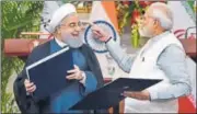  ?? VIPIN KUMAR/HT ?? Iranian president Hassan Rouhani (left) and Prime Minister
▪
Narendra Modi release a commemorat­ive stamp in New Delhi on Saturday.