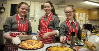  ??  ?? Students preparing food dishes for their home economics class.