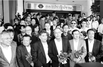  ??  ?? Pheu Thai party leaders leave the crime suppressio­n division after being charged with sedition and violating the ban on gatherings, in Bangkok. — AFP photo