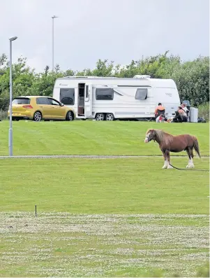  ??  ?? VISITORS: Gypsy Travellers have set up camp on the Cove Youth FC training ground