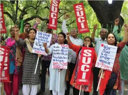  ?? — BUNNY SMITH ?? Socialist Unity Centre of India ( Communist) raise alogans against the hike in fuel prices in New Delhi on Thursday.