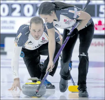  ?? MICHAEL BURNS/PHOTO ?? Laura Crocker brushes the stone for Geoff Walker during their round-robin win over Brendan Bottcher and Dana Ferguson on Thursday. Crocker and Walker finished first in Pool B at 8-0.