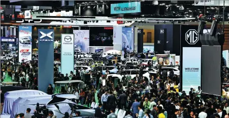  ?? CHALINEE THIRASUPA / REUTERS ?? Crowds throng the floor of the 45th Bangkok Internatio­nal Motor Show in Thailand on March 25.