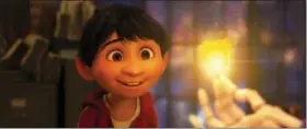  ?? DISNEY-PIXAR VIA AP ?? This image released by Disney-Pixar shows characters Miguel, voiced by Anthony Gonzalez in a scene from the animated film, “Coco.”