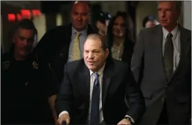  ?? SETH WENIG — THE ASSOCIATED PRESS FILE ?? Harvey Weinstein arrives at a Manhattan courthouse for jury deliberati­ons in his rape trial Feb. 24, 2020, in New York. New York’s highest court has overturned Weinstein’s 2020 rape conviction and ordered a new trial.