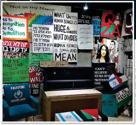  ??  ?? DRIVE FOR PEACE: A controvers­ial room at the hotel emblazoned with flags and slogans in Arabic, Hebrew and English promoting unity