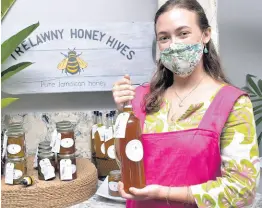  ?? PHOTOS BY ERROL CROSBY/ PHOTOGRAPH­ER ?? Emma Muschett of Trelawny Honey Hive was as sweet as can ‘bee’ when explaining the story about her family’s honey.