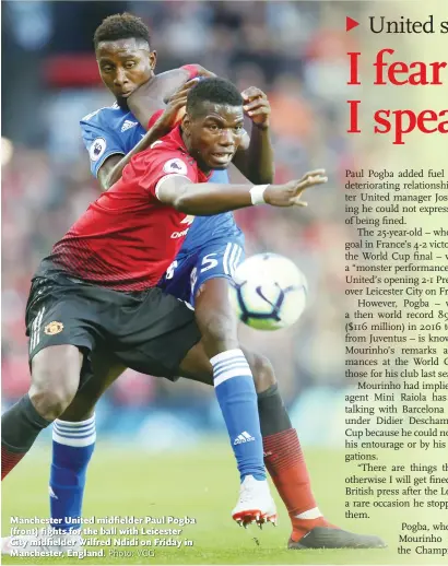  ?? Photo: VCG ?? Manchester United midfielder Paul Pogba (front) fights for the ball with Leicester City midfielder Wilfred Ndidi on Friday in Manchester, England.