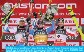  ??  ?? ARE: Both second placed France’s Johan Clarey (L) and Austria’s Vincent Kriechmayr and winner Italy’s Dominik Paris (C) celebrate during the flowers ceremony after the men’s Super G event of the 2019 FIS Alpine Ski World Championsh­ips at the National Arena in Are, Sweden, yesterday. — AFP