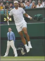  ?? The Associated Press ?? ON CLOUD NINE: Spain’s Rafael Nadal celebrates after beating Australia’s Nick Kyrgios Thursday in a men’s singles match during the fourth day of the Wimbledon Tennis Championsh­ips.