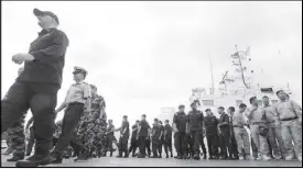  ??  ?? Coast guard men from Brunei, Malaysia, Indonesia, Singapore, Sri Lanka, Thailand, the US and the Philippine­s gather at the PCG headquarte­rs in Port Area, Manila for the opening of the Southeast Asia Cooperatio­n and Training exercises yesterday. EDD...