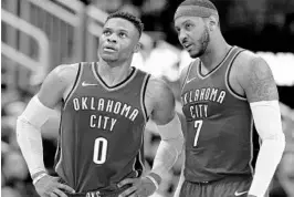  ??  ?? Oklahoma City Thunder guard Russell Westbrook, left, and forward Carmelo Anthony talk during the team’s recent game against the Rockets in Houston.