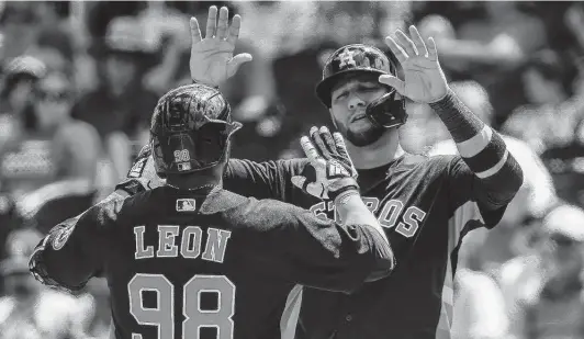  ?? Karen Warren / Staff photograph­er ?? First baseman Yuli Gurriel, right, is often regarded as the face of Cuban baseball. The Astros are the first team since the 1960s to employ at least 20 Cuban players.