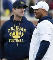  ?? ASSOCIATED PRESS FILE PHOTO ?? Michigan head coach Harbaugh, left, revamped his staff during the offseason, but opted to retain offensive coordinato­r Josh Gattis, right. Gattis recently earned the Broyles Award as college football’s top assistant coach.