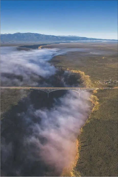  ?? CHRIS DAHL-BREDINE ?? The Río Grande Gorge Bridge shrouded in mist.