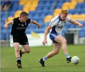  ??  ?? Newtown’s Dean Odlum tries to catch John Crowe of St Pat’s during the SFC clash in Joule Park Aughrim. Photo: Joe Byrne