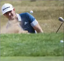  ?? NATHAN DENETTE, THE CANADIAN PRESS ?? American Dustin Johnson blasts out of the bunker on the ninth hole at the 2016 Canadian Open in Oakville on Thursday. He shot a 6-under 66.