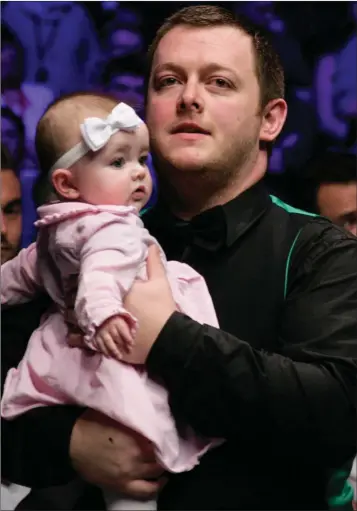  ??  ?? Mark Allen celebrates with his daughter after beating Kyren Wilson in the final of The Masters.