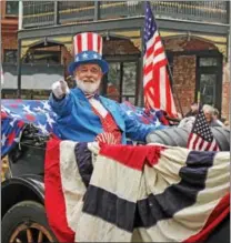  ?? CHRIS BARBER — DIGITAL FIRST MEDIA ?? Gerald Treadway as Uncle Sam waves to the crowd at the Kennett Square Memorial Day parade Monday.