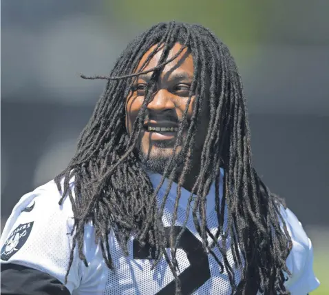  ?? KIRBY LEE, USA TODAY SPORTS ?? “We know what the struggle is,” veteran running back Marshawn Lynch, now with the Raiders, says of growing up in Oakland.