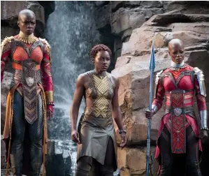 ?? MATT KENNEDY/DISNEY/MARVEL STUDIOS VIA AP ?? This image released by Disney-Marvel Studios shows, from left, Danai Gurira, Lupita Nyong'o and Florence Kasumba in a scene from "Black Panther." Gurira says the representa­tion of women in “Black Panther” is important for young girls to see. The film...