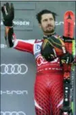  ?? MARCO TACCA — THE ASSOCIATED PRESS ?? Austria’s Marcel Hirscher celebrates on the podium at the end of a ski World Cup men’s Giant Slalom in Adelboden, Switzerlan­d, Saturday.