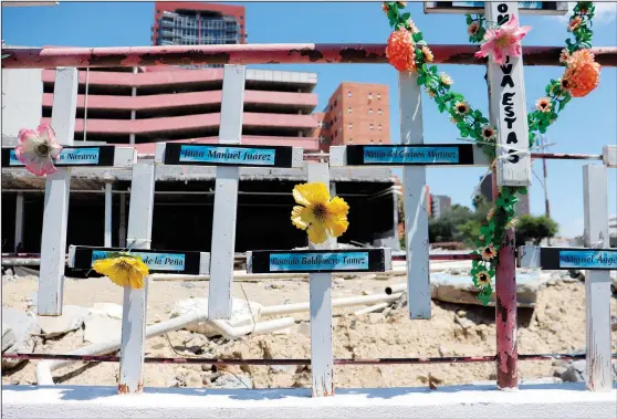  ?? (AP/Marcos Martinez Chacon) ?? In front of the land occupied by the Casino Royale, relatives have installed a memorial to remember the victims of the Aug. 25, 2011, attack on the Casino Royale, in Monterrey, Mexico.