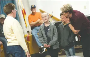  ?? NEWS-SENTINEL PHOTOGRAPH­S BY BEA AHBECK/NEWS-SENTINEL ?? Lodi Police Partner Mary Eggers, far right, whispers to Angelina Redfearn, left, and Oscar Rincon, middle, as they play out a scenario in which a stranger, played by Kathy Robertson, with the Lodi Crime Prevention Team, tries to pick them up from school without a password, as the Lodi Crime Prevention Team and Lodi Police Partners give a presentati­on at George Washington Elementary School in Lodi on Tuesday.