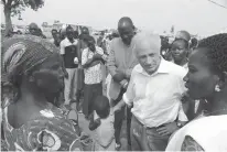  ?? Photo credit ?? Senator Bob Corker, R-Tenn., center, speaks Friday to recent refugees from South Sudan at a registrati­on center in Bidi Bidi, Uganda. Corker, the Republican chairman of the Foreign Relations Committee, strongly defended U.S. foreign assistance on Friday.