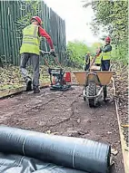  ?? PHOTO: IWA ?? Installing the new footpath along the Burslem Branch.