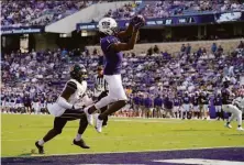  ?? Tony Gutierrez / Associated Press ?? TCU’s Quentin Johnston catches a TD pass in front of Cal’s Chigozie Anusiem in the second half. Johnston scored twice.