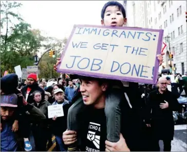  ?? YANA PASKOVA/THE NEW YORK TIMES ?? Demonstrat­ors protest the election of Donald Trump outside the Trump Parc condominiu­ms in Central Park South, Manhattan, on November 13. Citing everything from Zika to the harassment of foreigners and street protests, a number of foreign government­s...