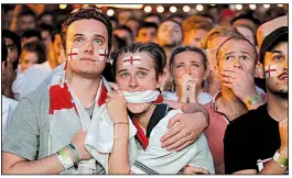  ??  ?? English fans watch in anguish AP/LUCA BRUNO from Flat Iron Square in London after Mario Mandzukic’s goal in extra time Wednesday, which gave Croatia a 2-1 victory over England.