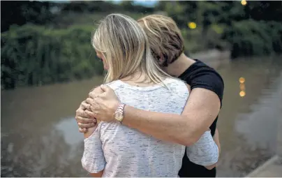  ?? Jon Shapley / Staff photograph­er ?? Janis hugs her daughter, Nicole, who counts herself among Chad Foster’s victims. She testified at his sentencing in Harris County, saying, “I feel like he’s a sick person. I think he’s going to do it again if he’s on probation.”