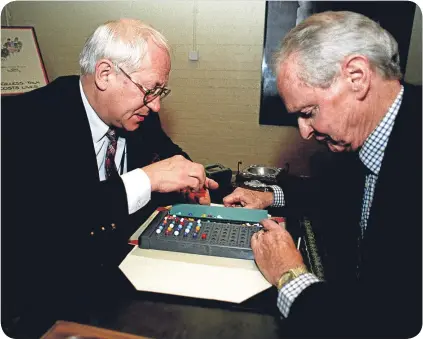  ??  ?? Once adversarie­s, Oleg Gordievsky (left) and codebreake­r Alan Stripp met in 1997 for a game of Mastermind at the Cabinet War Rooms.
