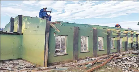  ?? ?? The damaged version of the classrooms at St. Michael’s High School.