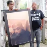  ?? TED SHAFFREY/AP FILES ?? Joe Prude (right) and his son, Armin, stand with a picture of Daniel Prude in Rochester, N.Y.