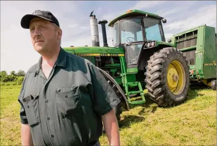  ??  ?? Dairy farmer Eric Ooms on his land in Valatie. His family has been in Columbia County since 1950.