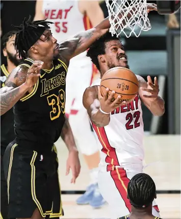  ?? WALLY SKALIJ TNS ?? No matter who the Los Angeles Lakers put on Heat wing Jimmy Butler (22), he has willed his team to stay alive for possibly Miami’s fourth NBA championsh­ip. He notched his second triple-double of the Finals in Friday’s Game 5 win.