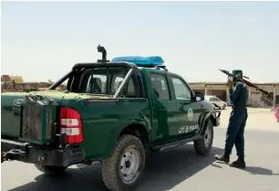  ?? AFP ?? An Afghan policeman holds a rocket-propelled grenade amid an ongoing battle with Taleban militants in the Gereshk district of Helmand province. —