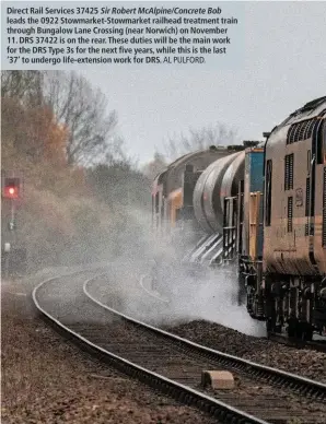  ?? AL PULFORD. ?? Direct Rail Services 37425 Sir Robert McAlpine/Concrete Bob leads the 0922 Stowmarket-Stowmarket railhead treatment train through Bungalow Lane Crossing (near Norwich) on November 11. DRS 37422 is on the rear. These duties will be the main work for the DRS Type 3s for the next five years, while this is the last ‘37’ to undergo life-extension work for DRS.