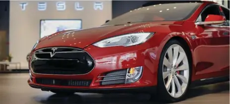  ?? MICHAEL SHORT/BLOOMBERG ?? Tesla issued an over-the-air computer update to Model S vehicles in service after hackers shut one down while being driven at low speed.