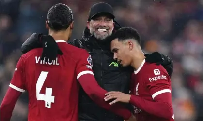  ?? ?? Jürgen Klopp embraces Virgil van Dijk and Trent Alexander-Arnold after Liverpool’s 4-3 win over Fulham. Photograph: Tim Keeton/EPA